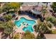 Overhead view of a luxurious community pool featuring a spa, sun deck, and palm trees at 11000 N 77Th Pl # 2042, Scottsdale, AZ 85260