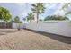 Low maintenance backyard with desert landscaping, mature trees, and private fencing at 1216 E Rowlands Ln, Phoenix, AZ 85022