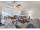 Open-concept living area with tiled floors, ceiling fan, and a dining area at 1216 E Rowlands Ln, Phoenix, AZ 85022