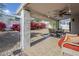 Covered patio area with comfortable seating and an outdoor ceiling fan at 1216 E Rowlands Ln, Phoenix, AZ 85022