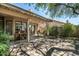 Relaxing backyard patio with dining and living areas, lush landscaping, and soft, decorative lighting for evening gatherings at 1243 W Sherri Dr, Gilbert, AZ 85233