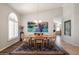 Cozy dining room with natural wood table set, vaulted ceiling, and a vintage chandelier at 1243 W Sherri Dr, Gilbert, AZ 85233