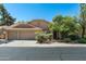 Charming single-story home with desert landscaping, tile roof, and a spacious three-car garage at 1243 W Sherri Dr, Gilbert, AZ 85233