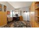 Bright home office with built-in bookshelves, large desk, and a comfortable chair, perfect for working from home at 1243 W Sherri Dr, Gilbert, AZ 85233