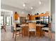 Well-lit kitchen featuring warm wood cabinets, granite countertops, and modern stainless steel appliances at 1243 W Sherri Dr, Gilbert, AZ 85233