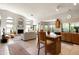 Open concept living space with kitchen island, fireplace, and plenty of natural light at 1243 W Sherri Dr, Gilbert, AZ 85233
