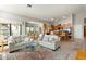Bright and open floor plan featuring a living room and kitchen with a view to the backyard at 1243 W Sherri Dr, Gilbert, AZ 85233