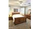 Cozy bedroom features a wood furniture set, neutral tones, and natural lighting at 1265 S Aaron -- # 299, Mesa, AZ 85209