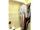 Well-organized closet with multiple hanging rods, shelving, and a selection of clothing at 1265 S Aaron -- # 299, Mesa, AZ 85209