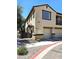 Well-maintained exterior view of the townhome, featuring a private entrance and an attached garage at 1265 S Aaron -- # 299, Mesa, AZ 85209