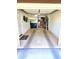 Spacious two car garage with epoxy flooring, built in storage, and shelving at 1265 S Aaron -- # 299, Mesa, AZ 85209