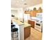 Clean kitchen featuring tile floors, breakfast bar and white appliances at 1265 S Aaron -- # 299, Mesa, AZ 85209