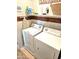 Functional laundry room with washer, dryer, storage shelves, and ample space at 1265 S Aaron -- # 299, Mesa, AZ 85209