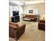 Cozy living area with plush carpeting, ceiling fan, and natural light perfect for relaxing at 1265 S Aaron -- # 299, Mesa, AZ 85209