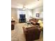 Comfortable living room featuring plush carpeting and a ceiling fan for relaxed living at 1265 S Aaron -- # 299, Mesa, AZ 85209