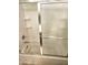 Clean white tiled shower and tub combo with sliding glass door at 1265 S Aaron -- # 299, Mesa, AZ 85209
