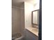 Bathroom featuring a vanity with storage and a shower-tub combination for a clean and modern look at 127 S 75Th Pl, Mesa, AZ 85208