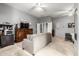 Large bedroom featuring a sofa, TV, and dresser, offering a cozy and inviting space at 12798 W Dove Wing Way, Peoria, AZ 85383
