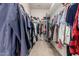Walk-in closet with organized shelving, racks, and plenty of storage space for clothes and accessories at 12798 W Dove Wing Way, Peoria, AZ 85383