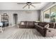 Bright living room featuring a wall-mounted television, a sign that reads Blessed and sectional sofa at 12798 W Dove Wing Way, Peoria, AZ 85383