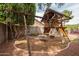 Spacious backyard featuring a playset, offering plenty of room for to play and enjoy outdoor activities at 12936 W Flower St, Avondale, AZ 85392