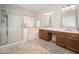 Bathroom featuring a tub, shower, double vanity, and tile floor at 12936 W Flower St, Avondale, AZ 85392