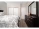 Bedroom featuring neutral walls, carpet, closet and dresser with a mirror at 12936 W Flower St, Avondale, AZ 85392