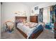 Bedroom with a colorful Mario themed bed, decorations, and wood furniture at 12936 W Flower St, Avondale, AZ 85392
