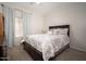Cozy bedroom with neutral walls, carpet and large window for natural light at 12936 W Flower St, Avondale, AZ 85392