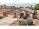 Inviting single-story home with a neutral stucco facade, tile roof, and low-maintenance landscaping for easy care at 12936 W Flower St, Avondale, AZ 85392