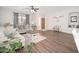 Bright living room with comfortable seating, natural light, and wood laminate flooring at 12936 W Flower St, Avondale, AZ 85392