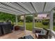 Back patio with a shaded pergola, barbecue and lovely backyard views at 13023 W Tangelo Dr, Sun City West, AZ 85375