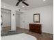 Bedroom showcasing tile floors, walk-in closet, ceiling fan, and a connecting bathroom for added privacy at 13023 W Tangelo Dr, Sun City West, AZ 85375