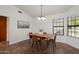 Cozy dining area with chandelier lighting and a large window at 13023 W Tangelo Dr, Sun City West, AZ 85375