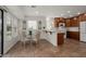 Bright dining area with sliding glass door access to the outdoor patio area at 13023 W Tangelo Dr, Sun City West, AZ 85375
