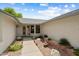 Inviting front entrance with desert landscaping, creating a warm and welcoming curb appeal at 13023 W Tangelo Dr, Sun City West, AZ 85375