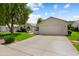Charming single-story home with a two-car garage, a well-manicured lawn, and attractive desert landscaping at 13023 W Tangelo Dr, Sun City West, AZ 85375