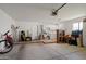 Spacious garage featuring laundry area, utility sink and plenty of room for storage at 13023 W Tangelo Dr, Sun City West, AZ 85375
