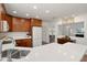 Bright kitchen features updated appliances, breakfast bar, and recessed lighting at 13023 W Tangelo Dr, Sun City West, AZ 85375