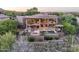 Aerial view of a luxurious home with balconies, a pool, and desert landscaping at 15135 E Sundown Dr, Fountain Hills, AZ 85268