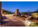Inviting backyard features a pool, fireplace, and comfortable lounge seating, perfect for enjoying the serene mountain landscape at 15135 E Sundown Dr, Fountain Hills, AZ 85268