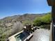 Mountain view backyard featuring a hot tub, fireplace, and patio set at 15135 E Sundown Dr, Fountain Hills, AZ 85268