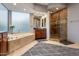 Elegant bathroom featuring a soaking tub, walk-in shower, and double sink vanity at 15135 E Sundown Dr, Fountain Hills, AZ 85268