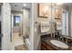 Bathroom showcasing a granite vanity and a shower-over-tub combo with mountain view at 15135 E Sundown Dr, Fountain Hills, AZ 85268