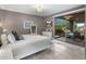 Bright bedroom featuring sliding glass doors, neutral walls, and tiled floors at 15135 E Sundown Dr, Fountain Hills, AZ 85268