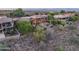Beautiful multi-story home with large windows, pool, and mountain views surrounded by mature landscaping at 15135 E Sundown Dr, Fountain Hills, AZ 85268
