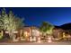 Inviting desert home with beautiful landscaping and nighttime illumination enhancing curb appeal at 15135 E Sundown Dr, Fountain Hills, AZ 85268