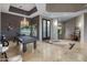 Spacious game room with a pool table, chandelier, and a view to a garden at 15135 E Sundown Dr, Fountain Hills, AZ 85268
