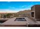 Secluded hot tub area features a fireplace and mountain views, offering a private and relaxing spa experience at 15135 E Sundown Dr, Fountain Hills, AZ 85268