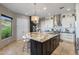 Gourmet kitchen island with granite countertops, seating, and modern appliances at 15135 E Sundown Dr, Fountain Hills, AZ 85268
